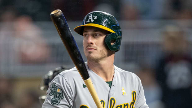 Athletics outfielder Brent Rooker walks off the plate after striking out.